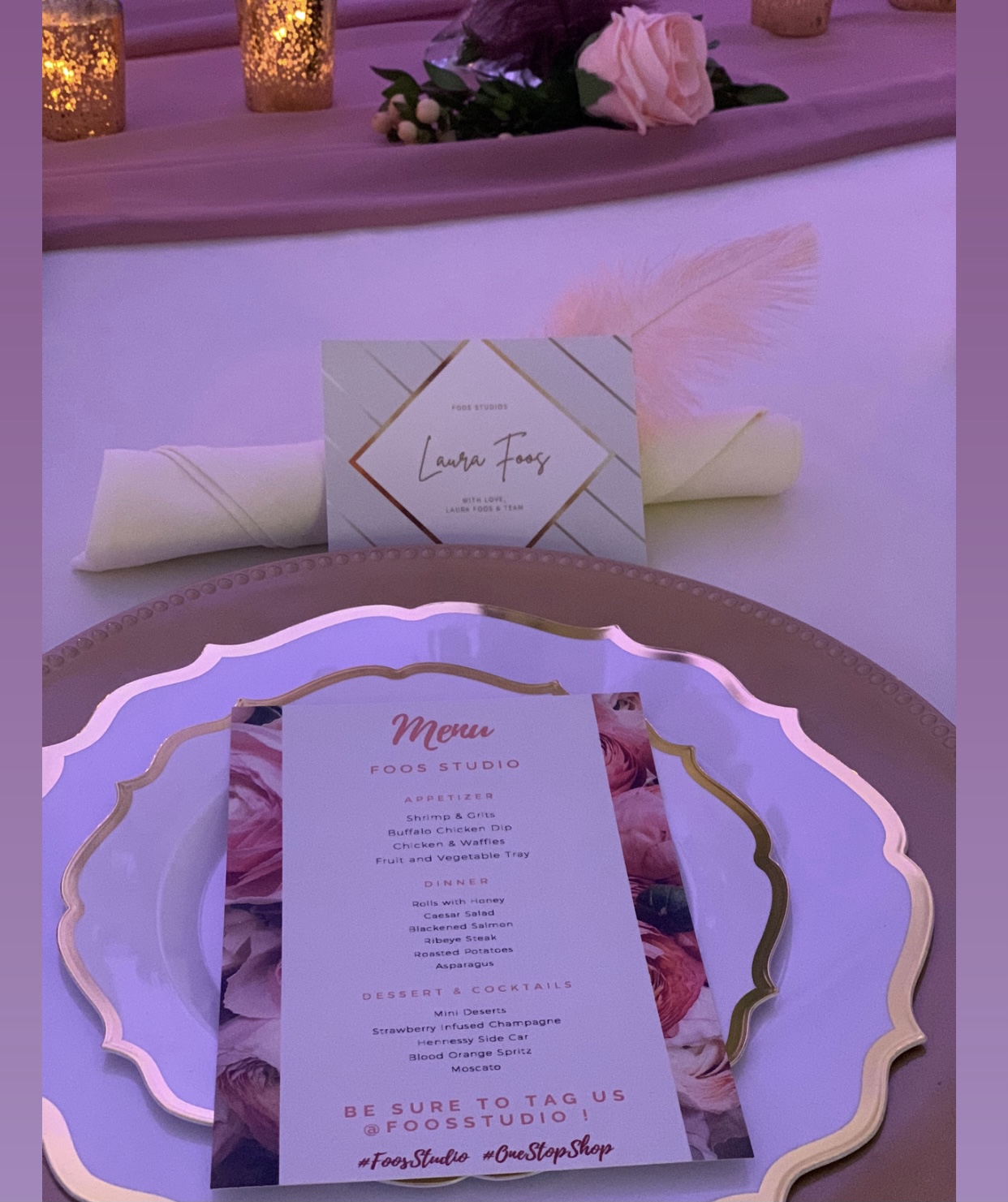 Pink and gold place setting with a personalized card and event menu