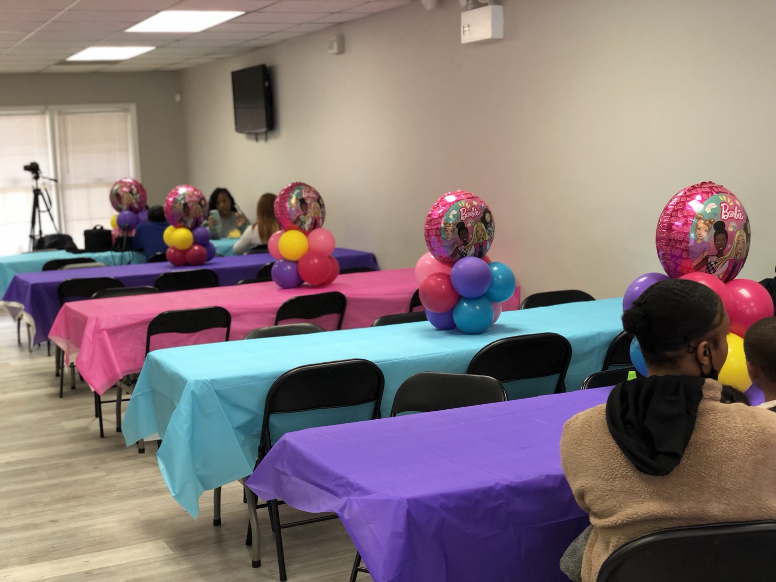 Bright pink, turquoise, and purple birthday tables